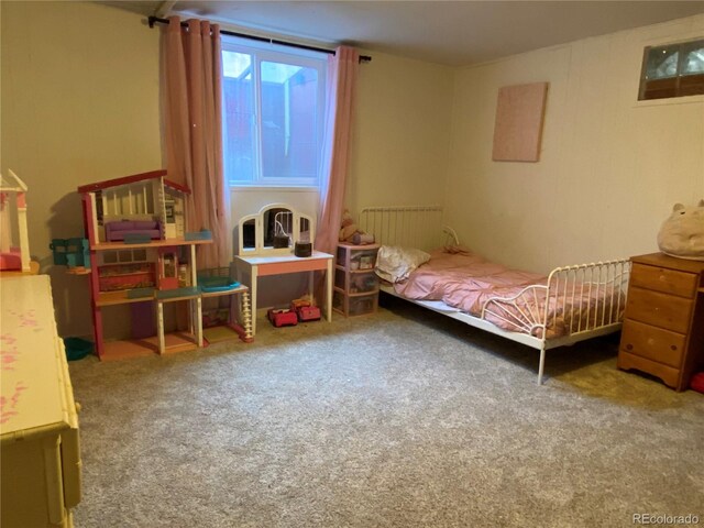 carpeted bedroom with radiator heating unit