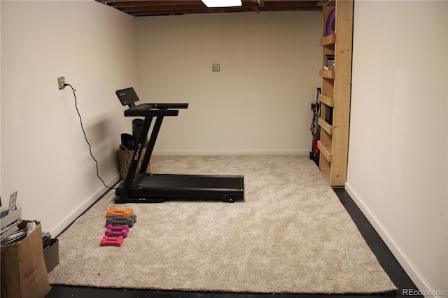 exercise area with dark colored carpet