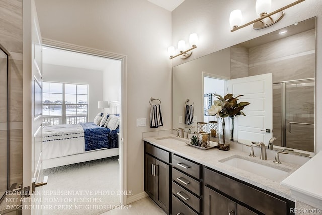 917 W 129th Pl, Denver, CO 80234 - bathroom featuring ensuite bath, double vanity, a stall shower, and baseboards
