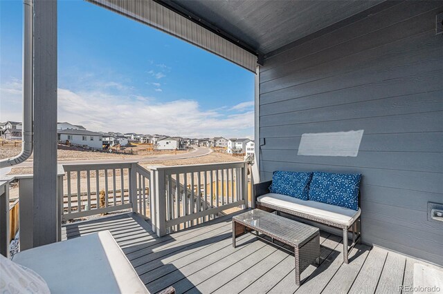 wooden deck featuring a residential view