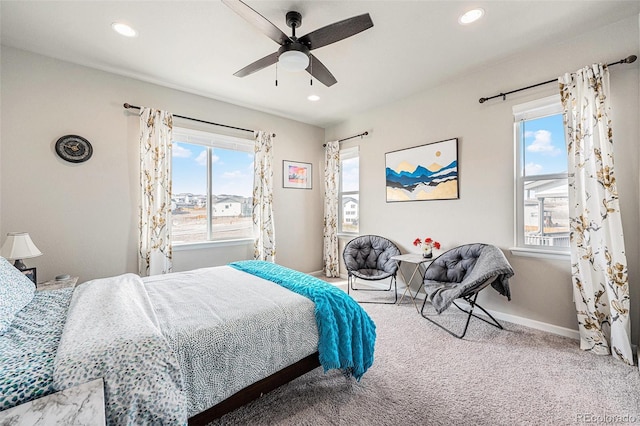 carpeted bedroom with recessed lighting, multiple windows, baseboards, and ceiling fan