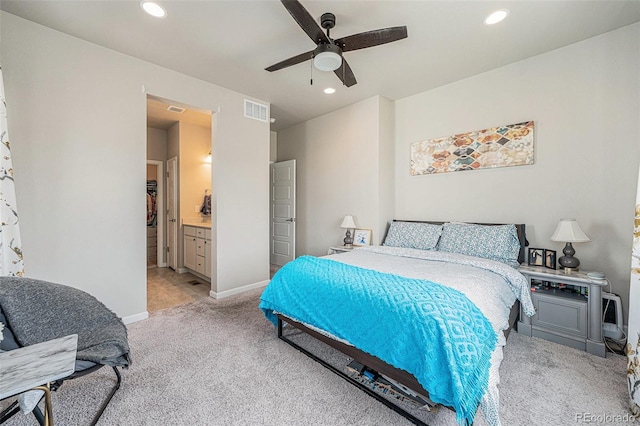 bedroom with recessed lighting, visible vents, light colored carpet, and baseboards