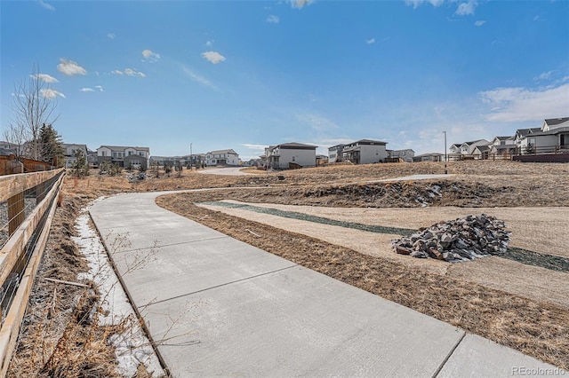 view of yard with fence and a residential view