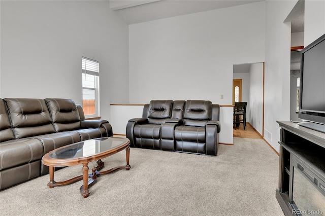 5056 E 112th Ct, Thornton, CO 80233 - carpeted living area featuring high vaulted ceiling and baseboards