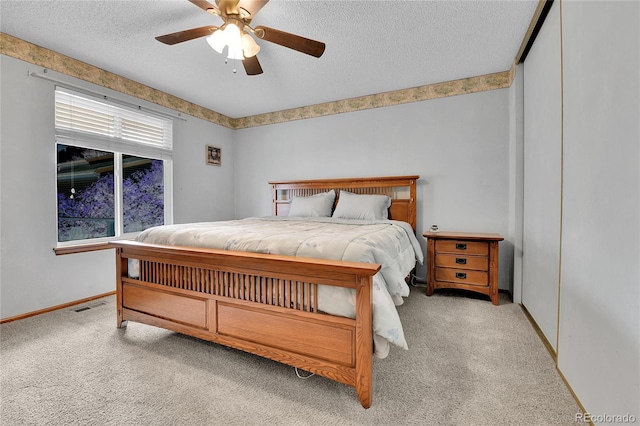 5056 E 112th Ct, Thornton, CO 80233 - carpeted bedroom with a textured ceiling and ceiling fan