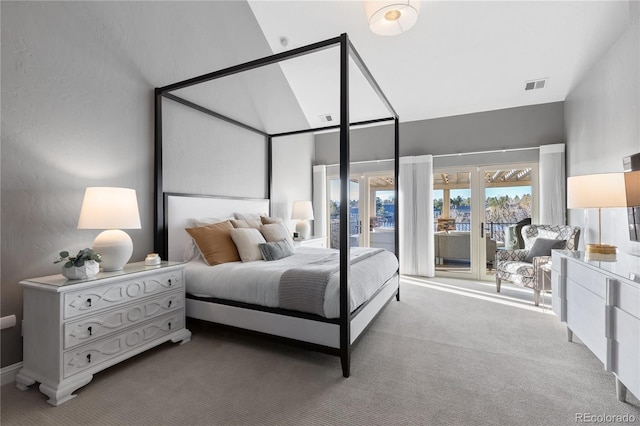 bedroom featuring visible vents, high vaulted ceiling, carpet flooring, and access to outside