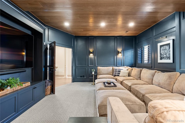 cinema featuring wooden ceiling, a decorative wall, and recessed lighting