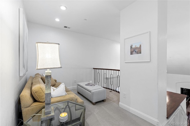 carpeted living room with recessed lighting, visible vents, and baseboards