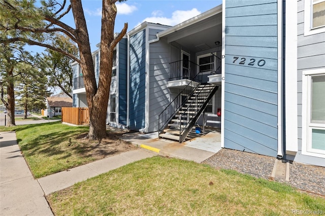 7220 S Gaylord St Unit G17, Littleton, CO 80122 - view of property exterior with a yard and stairway