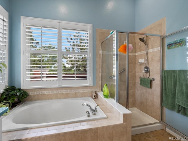 5660 S Eaton St, Littleton, CO 80123 - full bathroom with a garden tub, a shower stall, and plenty of natural light