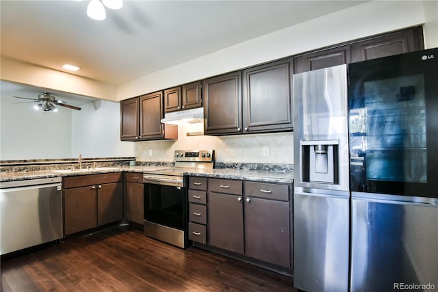 7185 S Gaylord St Unit A, Littleton, CO 80122 - kitchen featuring stainless steel appliances, a sink, a ceiling fan, under cabinet range hood, and dark wood finished floors