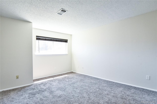 7185 S Gaylord St Unit A, Littleton, CO 80122 - unfurnished room featuring carpet, a textured ceiling, and baseboards
