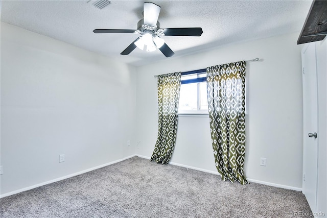 7185 S Gaylord St Unit A, Littleton, CO 80122 - empty room featuring a textured ceiling, carpet flooring, ceiling fan, and baseboards
