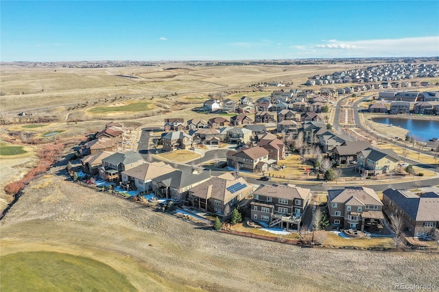 bird's eye view with a residential view and a water view