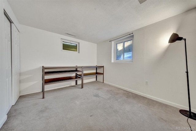 2279 S Lewiston St, Aurora, CO 80013 - below grade area featuring carpet and a textured ceiling