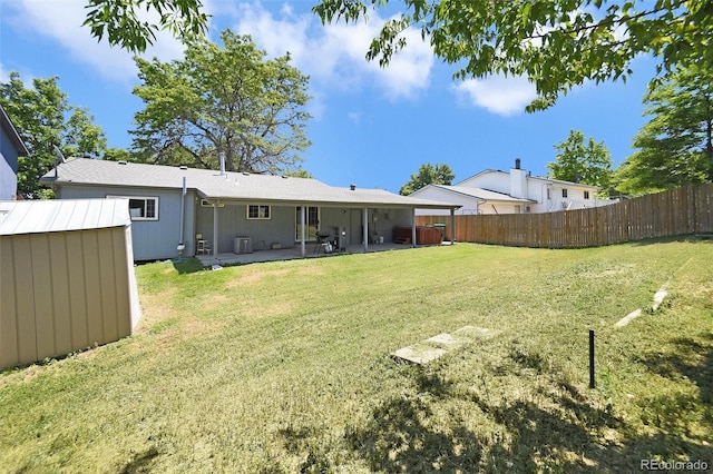 2279 S Lewiston St, Aurora, CO 80013 - back of property featuring a shed and a patio area