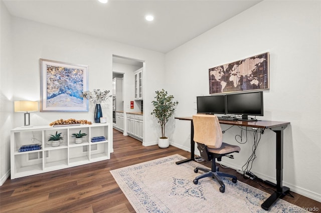 office area with dark wood-style floors, recessed lighting, and baseboards