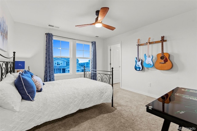 bedroom featuring a ceiling fan, carpet, visible vents, and baseboards