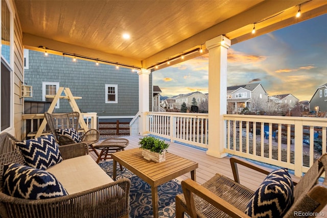 deck with a residential view and an outdoor living space