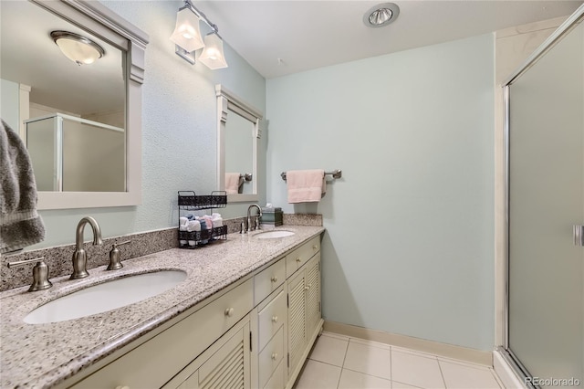 bathroom featuring walk in shower, tile patterned floors, and vanity