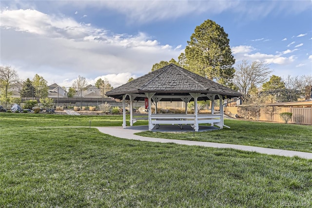 view of property's community with a gazebo and a lawn