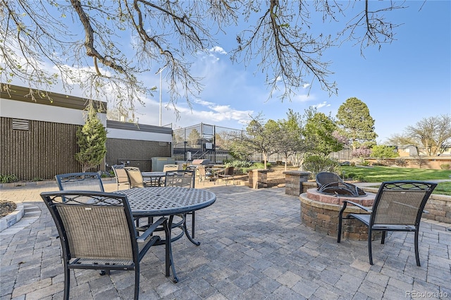 view of patio with an outdoor fire pit