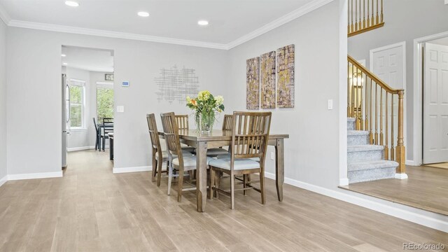 10052 Sage Sparrow Ct, Highlands Ranch, CO 80129 - dining space with light wood finished floors, stairway, and baseboards