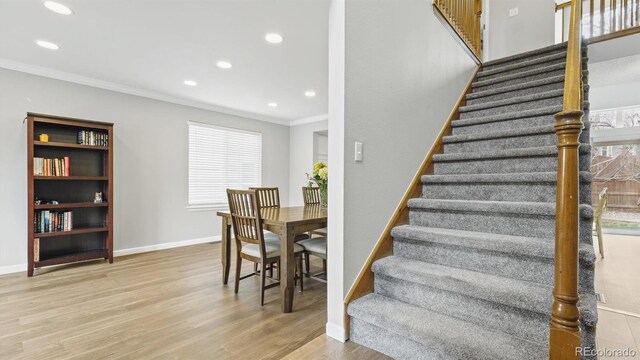 10052 Sage Sparrow Ct, Highlands Ranch, CO 80129 - staircase featuring ornamental molding, baseboards, recessed lighting, and wood finished floors