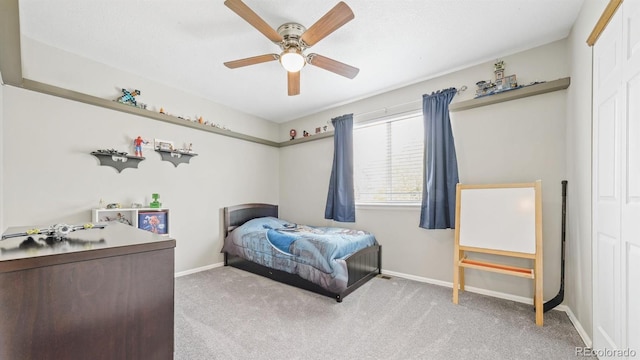 bedroom featuring ceiling fan, carpet floors, and baseboards