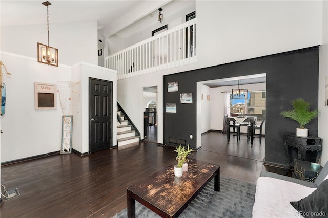 living room with high vaulted ceiling and dark hardwood / wood-style floors