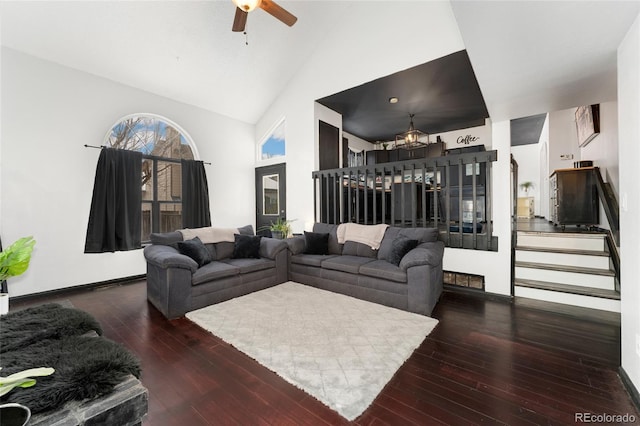 living room featuring high vaulted ceiling, ceiling fan, and dark hardwood / wood-style flooring