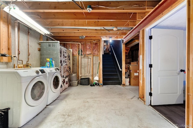 clothes washing area with separate washer and dryer