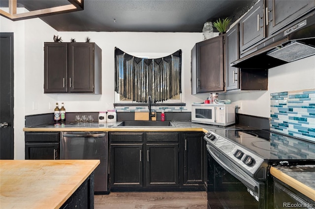 kitchen featuring range with electric stovetop, sink, stainless steel dishwasher, light hardwood / wood-style floors, and dark brown cabinets