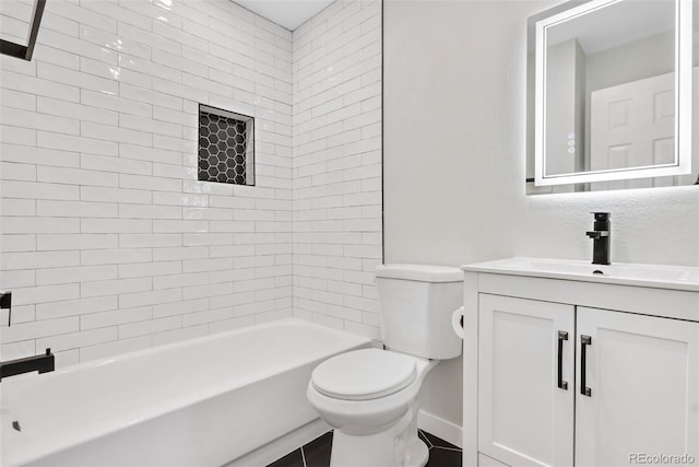 full bathroom featuring toilet, tiled shower / bath, and vanity