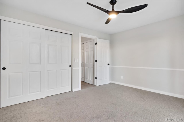 unfurnished bedroom with light carpet, a closet, and ceiling fan