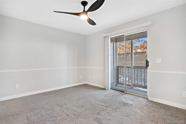 carpeted empty room featuring ceiling fan