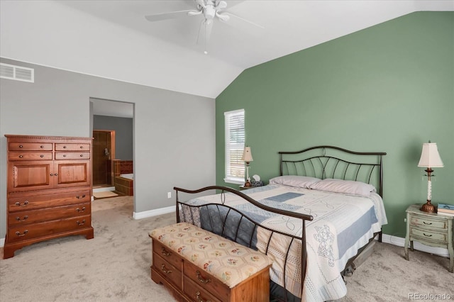 bedroom featuring visible vents, ensuite bathroom, light carpet, vaulted ceiling, and baseboards