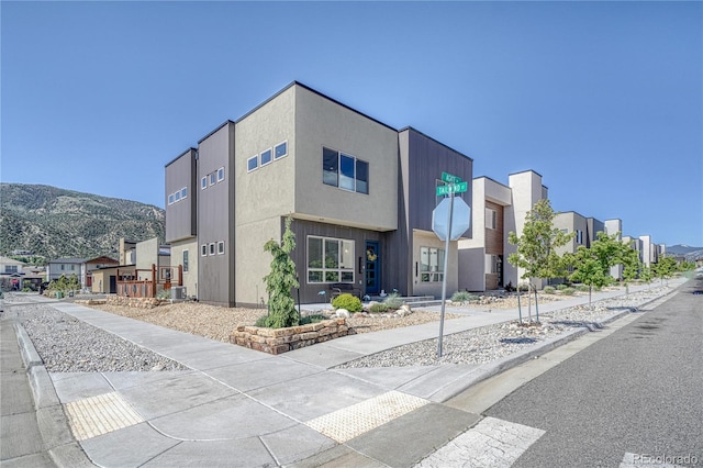1139 Agate Ln, Poncha Springs, CO 81242 - view of building exterior featuring central AC, a residential view, and a mountain view