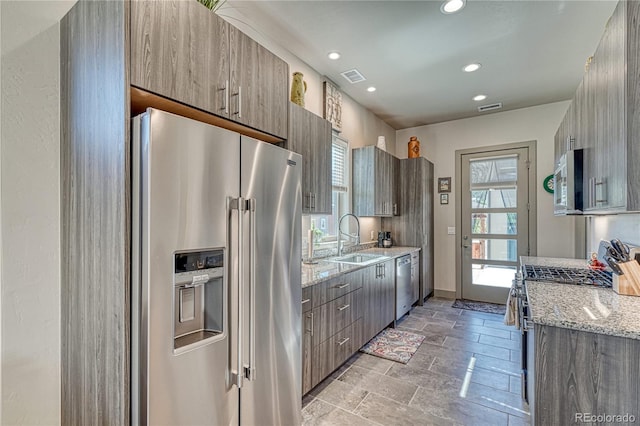 1139 Agate Ln, Poncha Springs, CO 81242 - kitchen with stainless steel appliances, a sink, light stone finish flooring, recessed lighting, and light stone counters