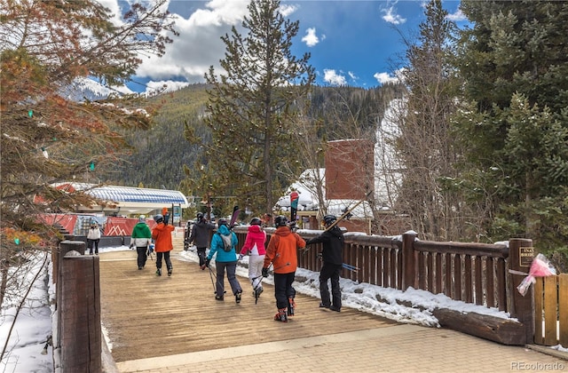 view of home's community with a deck with mountain view