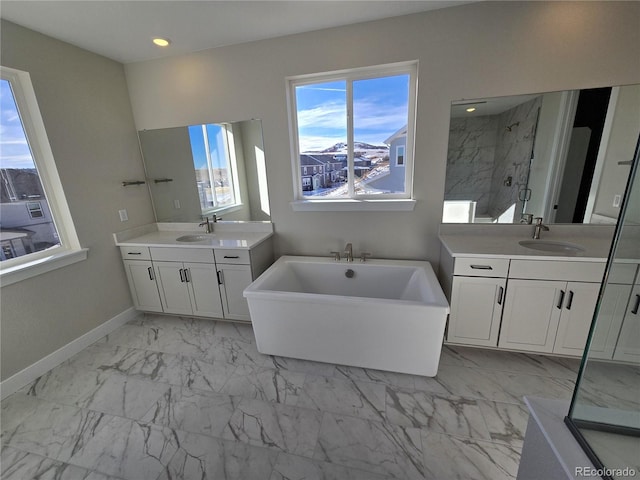 bathroom featuring vanity and shower with separate bathtub