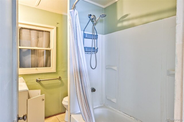 bathroom with tile patterned flooring, toilet, and shower / tub combo with curtain