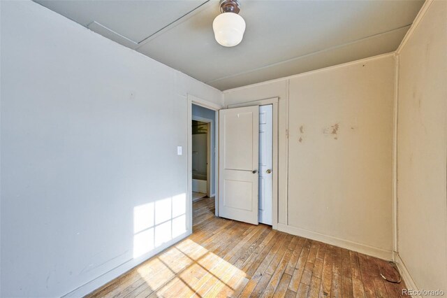 spare room with light hardwood / wood-style flooring