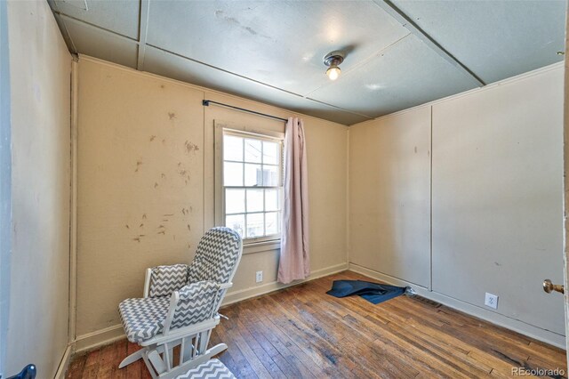 sitting room featuring dark hardwood / wood-style flooring