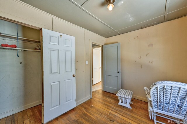 bedroom featuring a closet and wood-type flooring