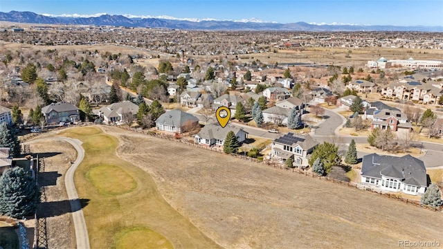 drone / aerial view with a residential view and a mountain view