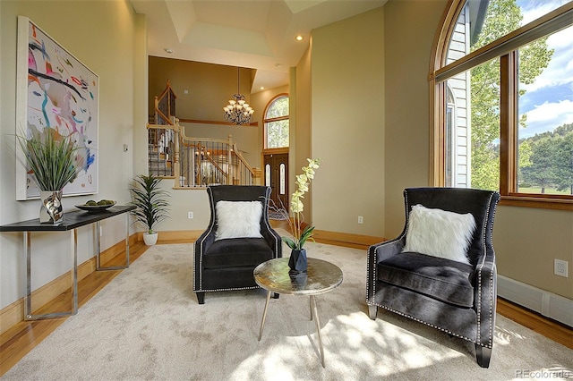2191 Baldy Ln, Evergreen, CO 80439 - sitting room featuring a chandelier, plenty of natural light, wood finished floors, and recessed lighting