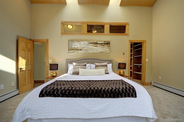 2191 Baldy Ln, Evergreen, CO 80439 - carpeted bedroom featuring a baseboard heating unit