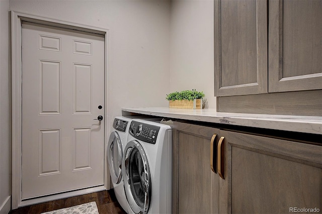 2191 Baldy Ln, Evergreen, CO 80439 - washroom featuring washer and clothes dryer, dark wood-style floors, and cabinet space