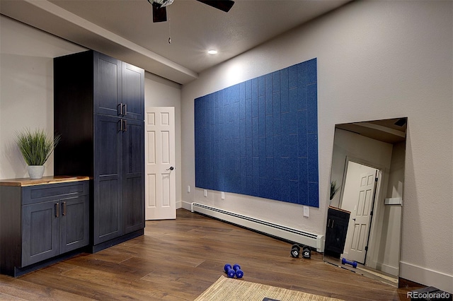 2191 Baldy Ln, Evergreen, CO 80439 - exercise area with baseboard heating, dark wood finished floors, and ceiling fan